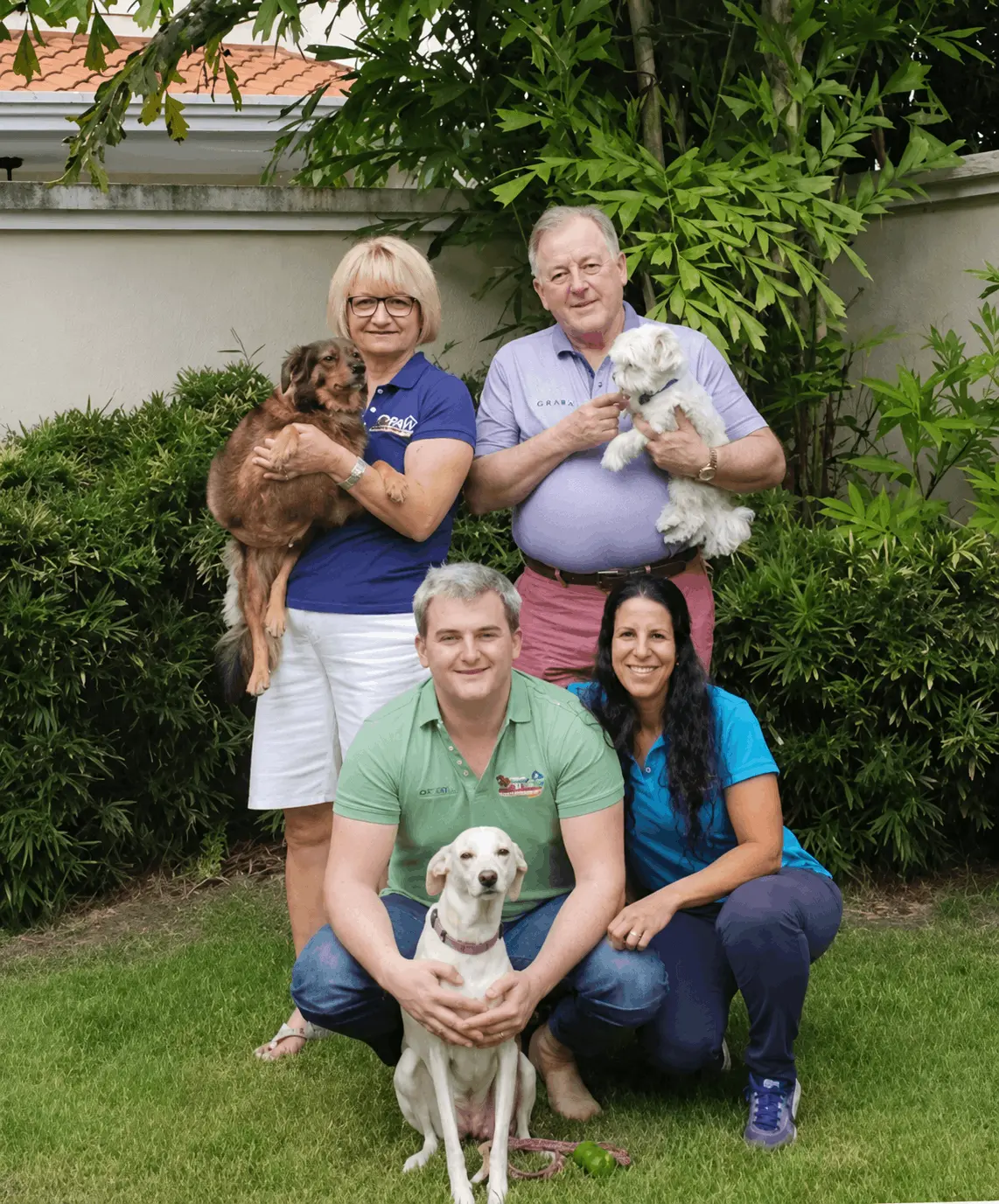 The VIP Vacation Kennels family with their dogs